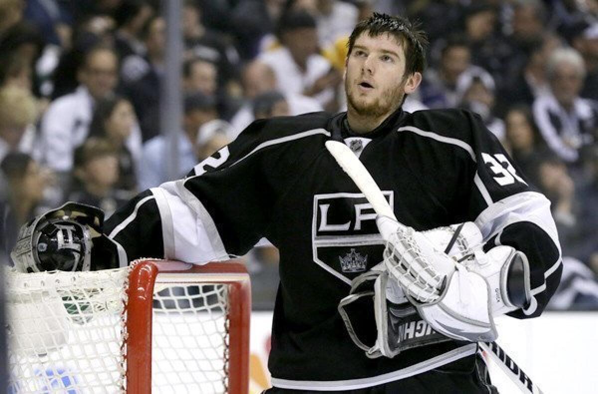 Kings goalie Jonathan Quick catches his breath during a break in the second period of Game 7 against the Sharks.