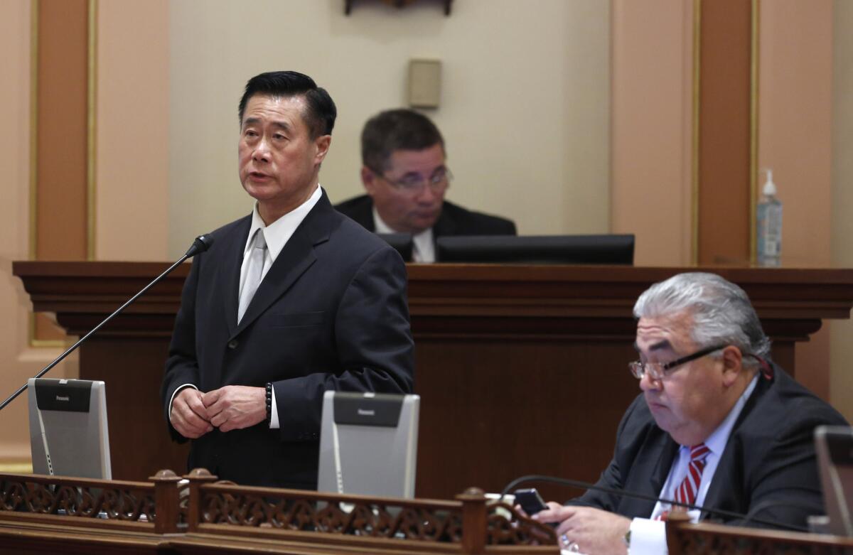 State Sen. Leland Yee (D-San Francisco), left, speaks on a bill beside Sen. Ron Calderon (D-Montebello) in March, before the two were arrested in separate cases.