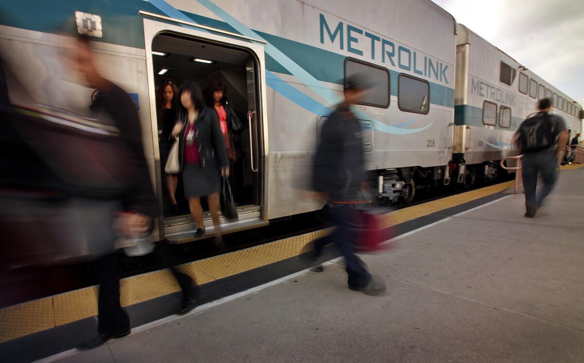 Incoming Metrolink passengers exit their train at Union Station in downtown Los Angeles.