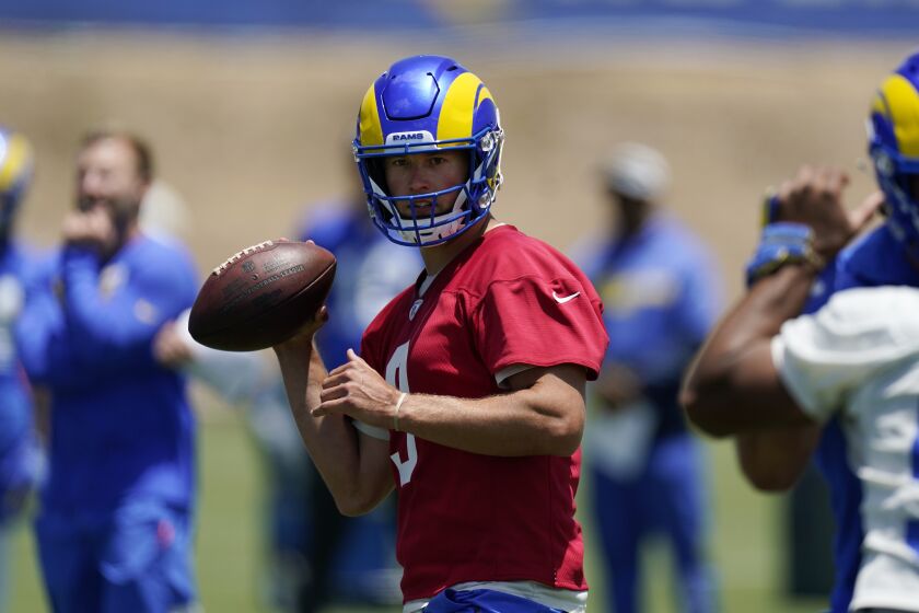 Los Angeles Rams quarterback Matthew Stafford fakes a pass during an NFL football practice Tuesday, June 8, 2021, in Thousand Oaks, Calif. (AP Photo/Mark J. Terrill)