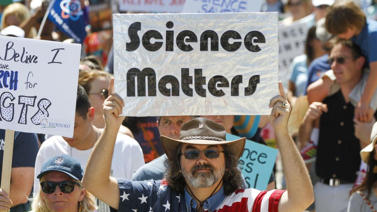 Marchers make their way along Pacific Highway during the San Diego March for Science.