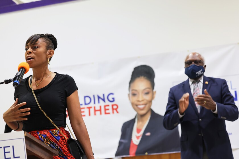 uyahoga Councilwoman and Congressional Candidate Shontel Brown speaks as Rep. James Clyburn (D-SC) claps 