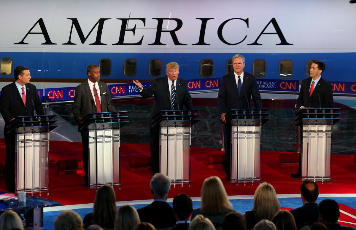 Republican presidential candidate Donald Trump, center, has been the focus of much of the GOP debate at the Reagan Library in Simi Valley.