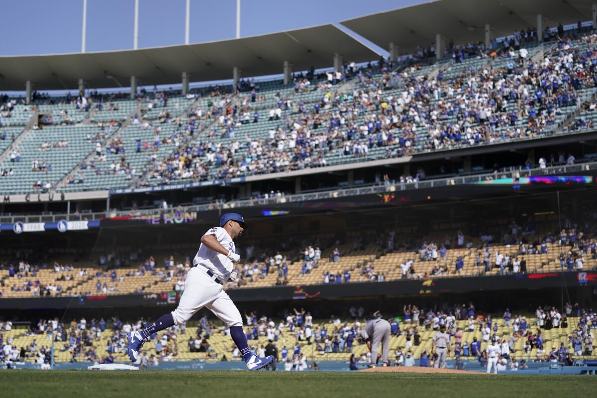 Albert Pujols rounds third base after hitting a home run during the ninth inning for the Dodgers on Sunday.
