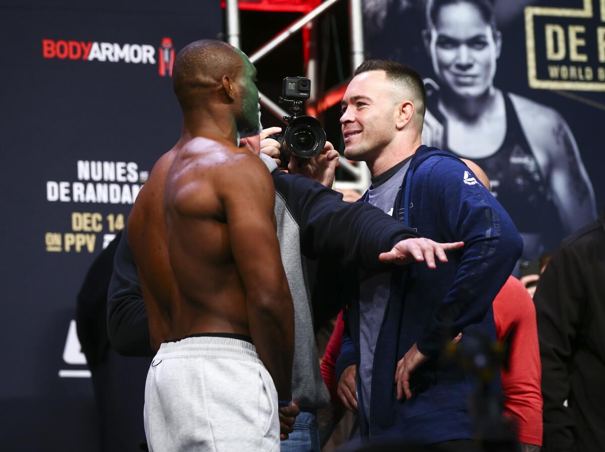 Kamaru Usman, left, and Colby Covington face off during the weigh-in ahead of their fight, which Usman won.
