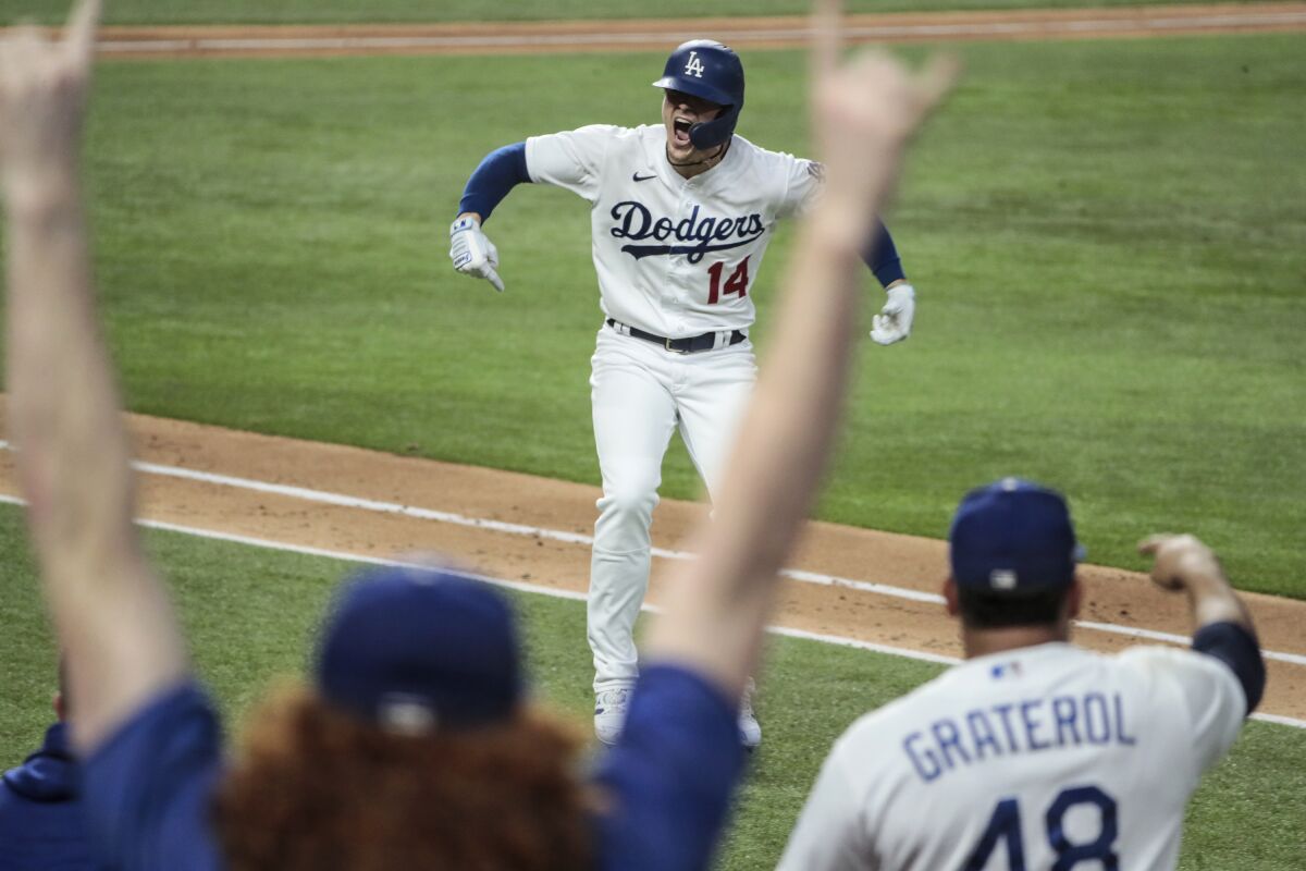 Dodgers pinch hitter Kiké Hernandez reacts after hitting a home run during the sixth inning in Game 7 of the NLCS.