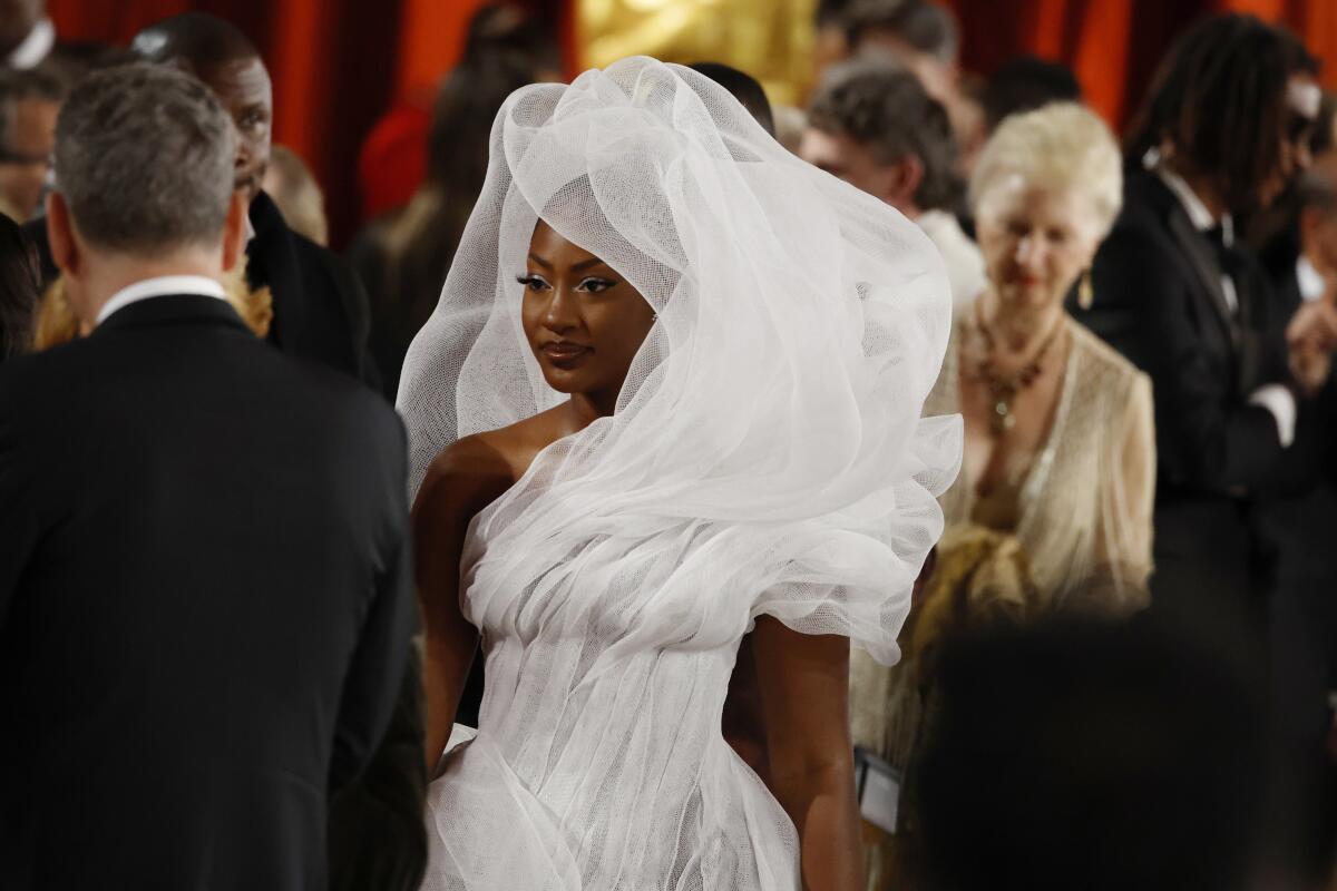 lady in white dress at oscars 2023 Michelle Yeoh and the Symbolism of White Dresses at the 2023 Oscars