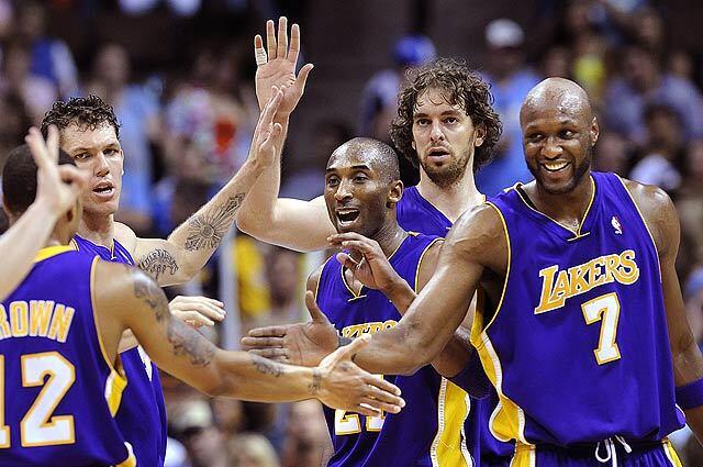Lakers from left, Luke Walton, Kobe Bryant, Pau Gasol and Lamar Odom celebrate with Shannon Brown who drew a foul against the Nuggets in Game 6 of the Western Conference Finals in Denver.