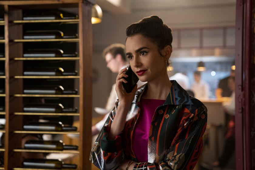 Emily in Paris. Lily Collins as Emily in episode 206 of Emily in Paris. Cr. Stephanie Branchu/Netflix © 2021