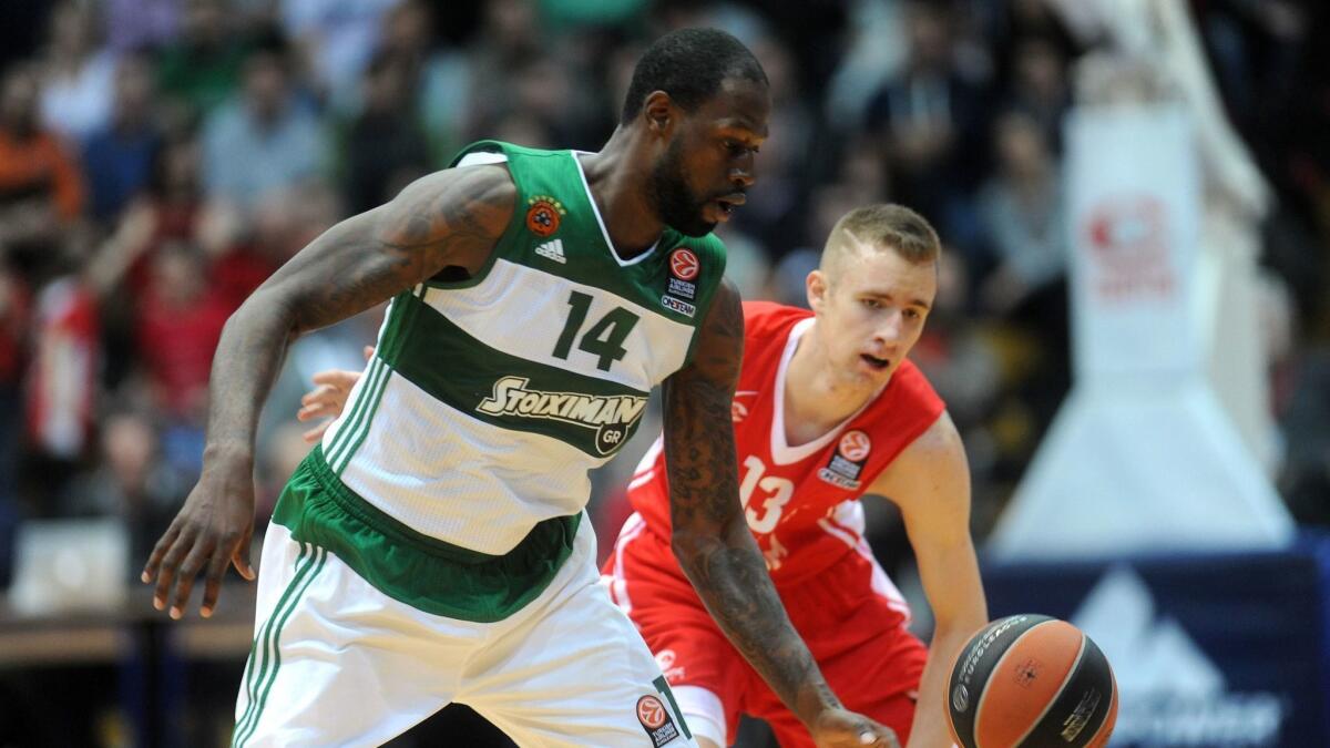 KK Cedevita's Dzanan Musa (13) chases after a loose ball against Panathinaikos' James Gist during a Euroleague game.