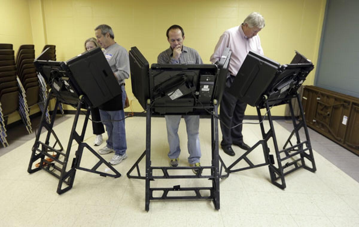 Voters cast their ballots in the general election at Kirkwood Community Center in Kirkwood, Mo.