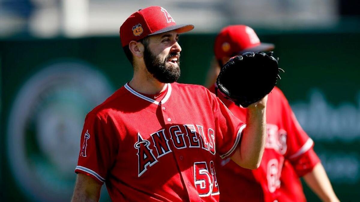Angels pitcher Matt Shoemaker warms up during a spring-training practice on Feb. 24 at Tempe Diablo Stadium.