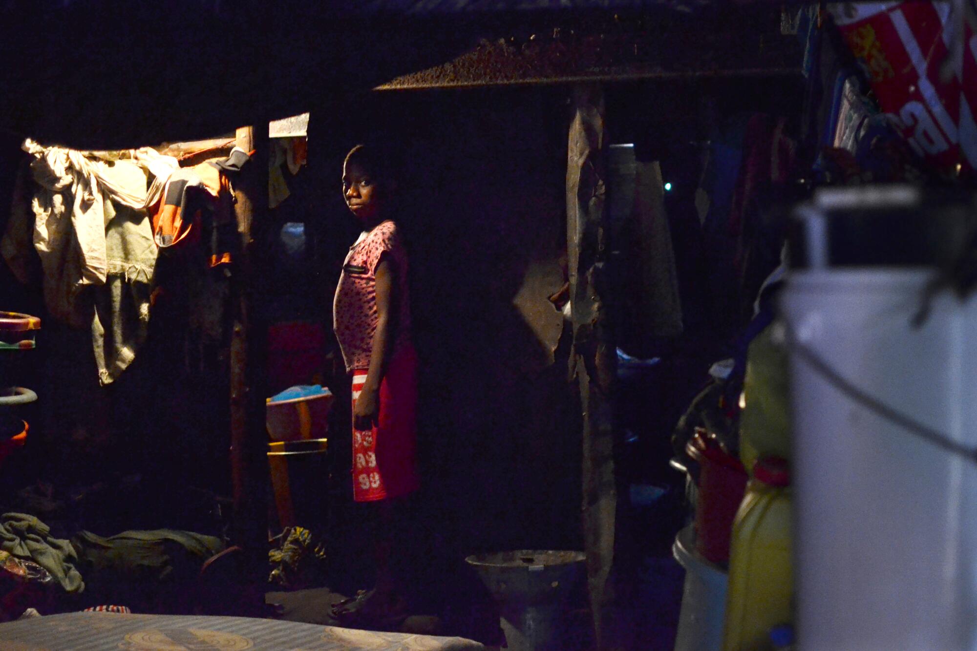 A resident of Freetown, Sierra Leone, in 2016. She takes care of her niece, an Ebola survivor.