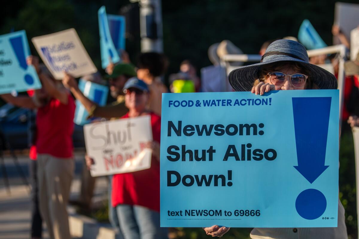 At a rally, Los Angeles residents call on Gov. Gavin Newsom to follow through on his pledge to shut down Aliso Canyon.
