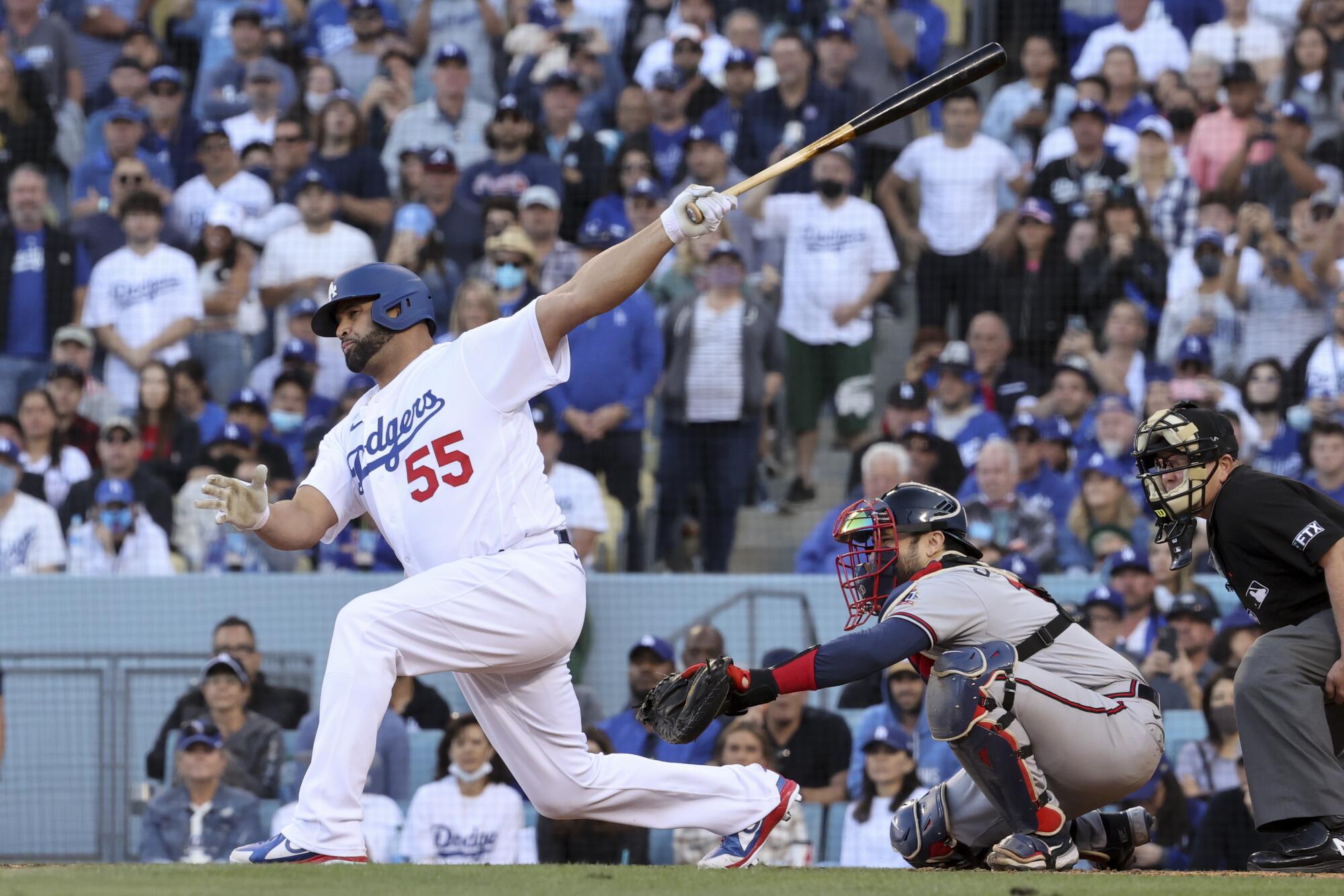 Albert Pujols strikes out during the sixth inning in Game 3.