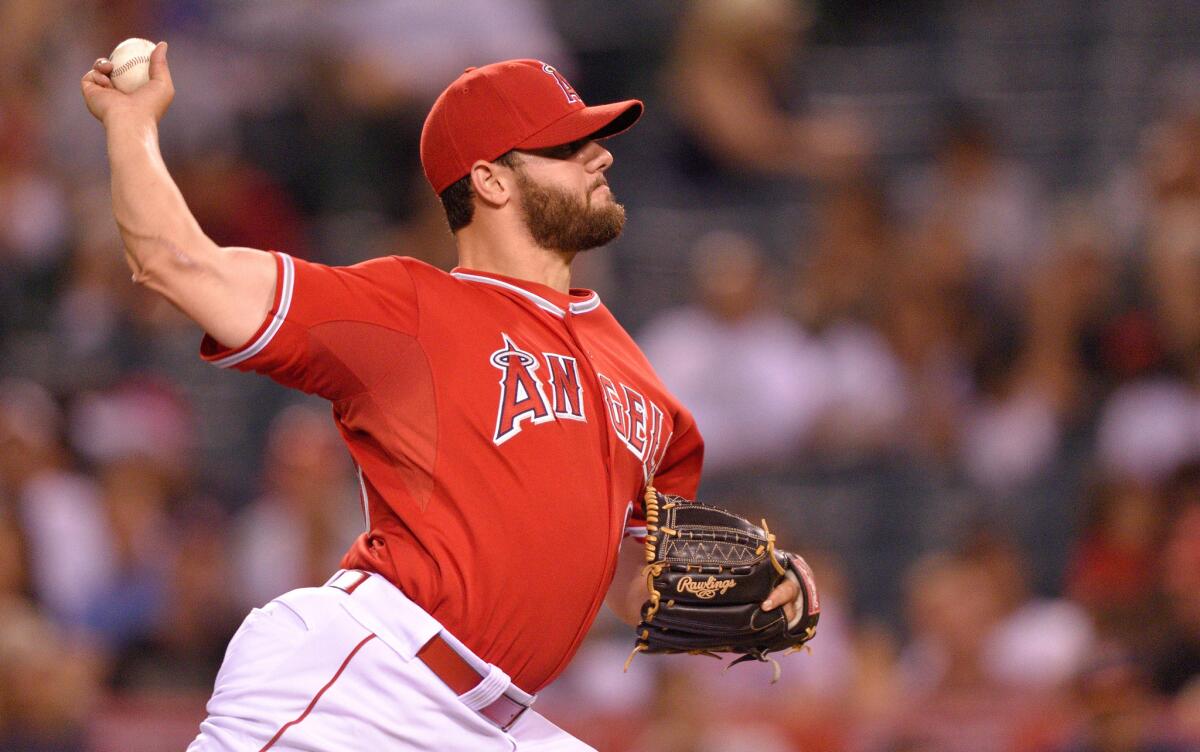 Angels right-hander Cam Bedrosian pitches during the game against the Astros on Sept. 12, 2014 at Angel Stadium.
