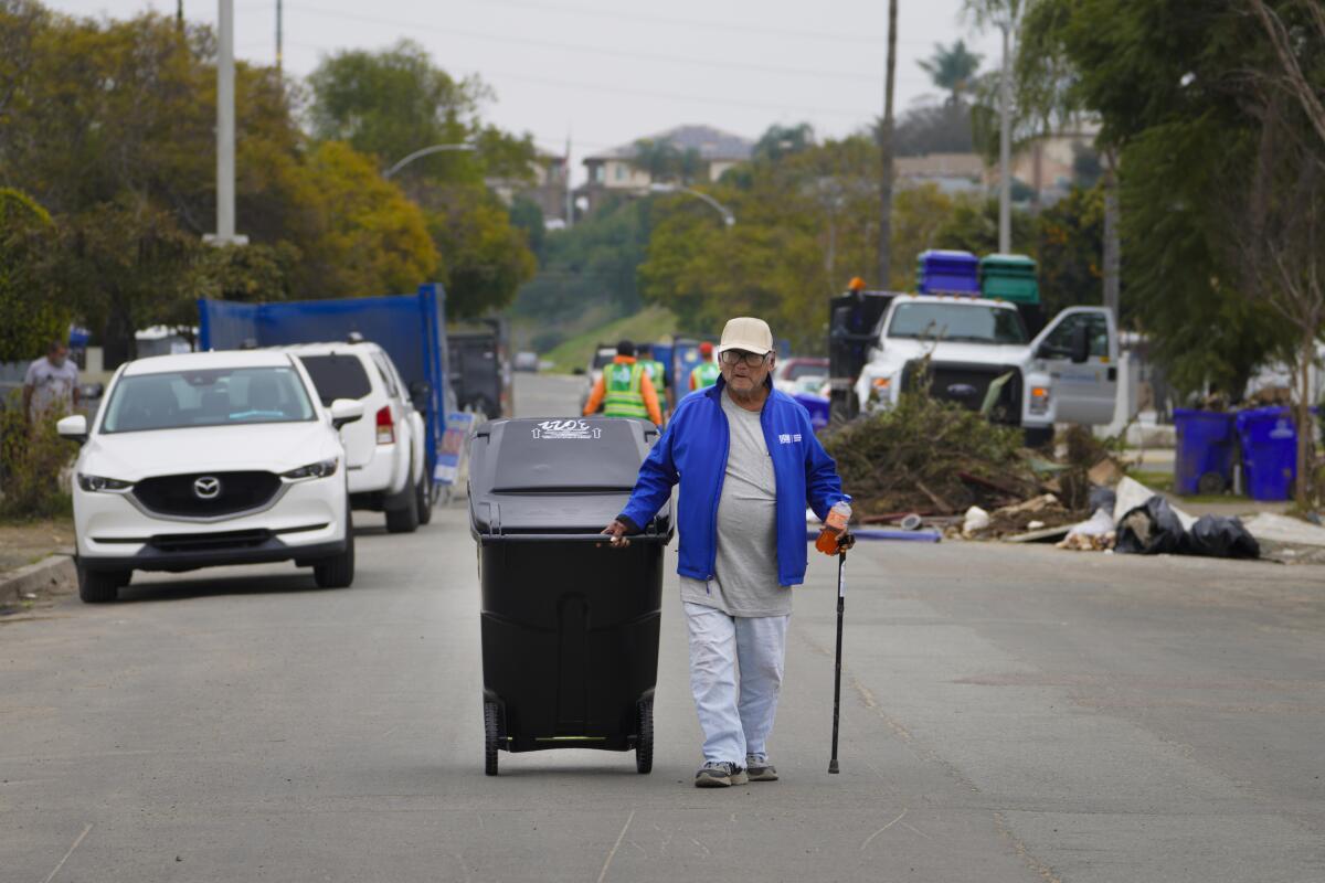 At Southcrest Community on Saturday, in San Diego, CA, Miguel Gomez received a free trash container
