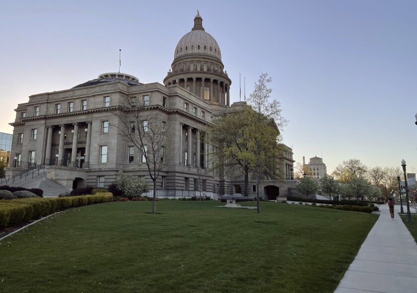 The Idaho Statehouse is seen at sunrise on April 20, 2021, in Boise, Idaho. Mainstream and far-right Republicans are battling for control of the party and the state in the deeply conservative state. (AP Photo/Keith Ridler)