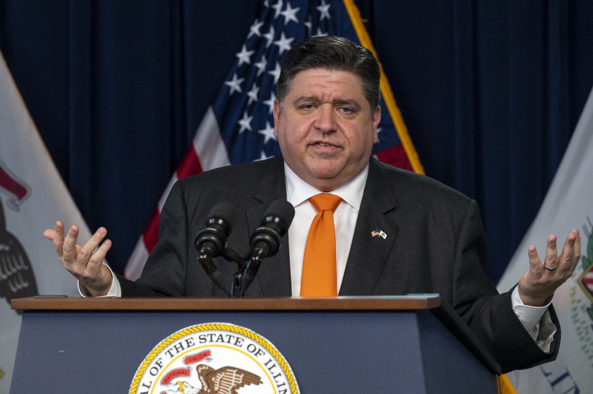 Illinois Gov. J.B. Pritzker gives a COVID-19 update to reporters in the Blue Room at the Thompson Center in Chicago, Wednesday, Feb. 9, 2022. (Tyler LaRiviere/Chicago Sun-Times via AP)