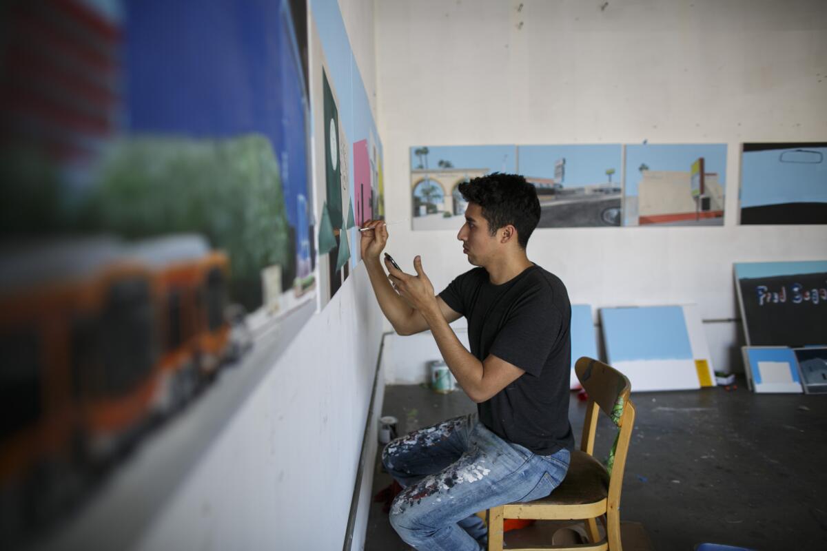 Painter Ramiro Gomez at work in his studio.