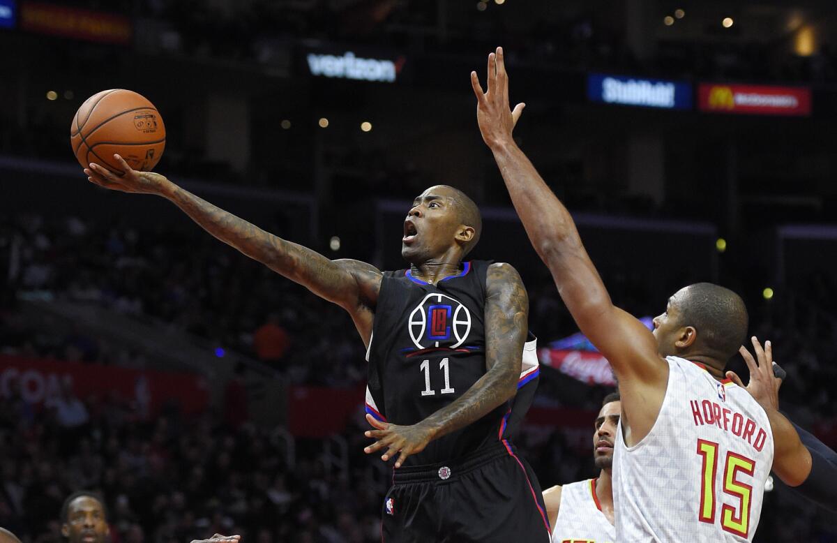 Clippers guard Jamal Crawford shoots against Atlanta center Al Horford.