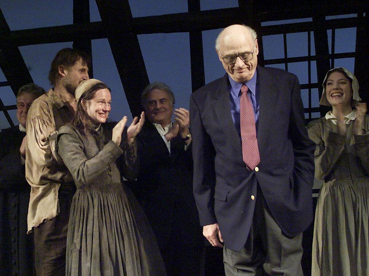 Arthur Miller takes a bow during the 2002 opening of the play "The Crucible" at the Virginia Theater in New York City. "The Crucible" has been removed from a key secondary school test in the U.K.