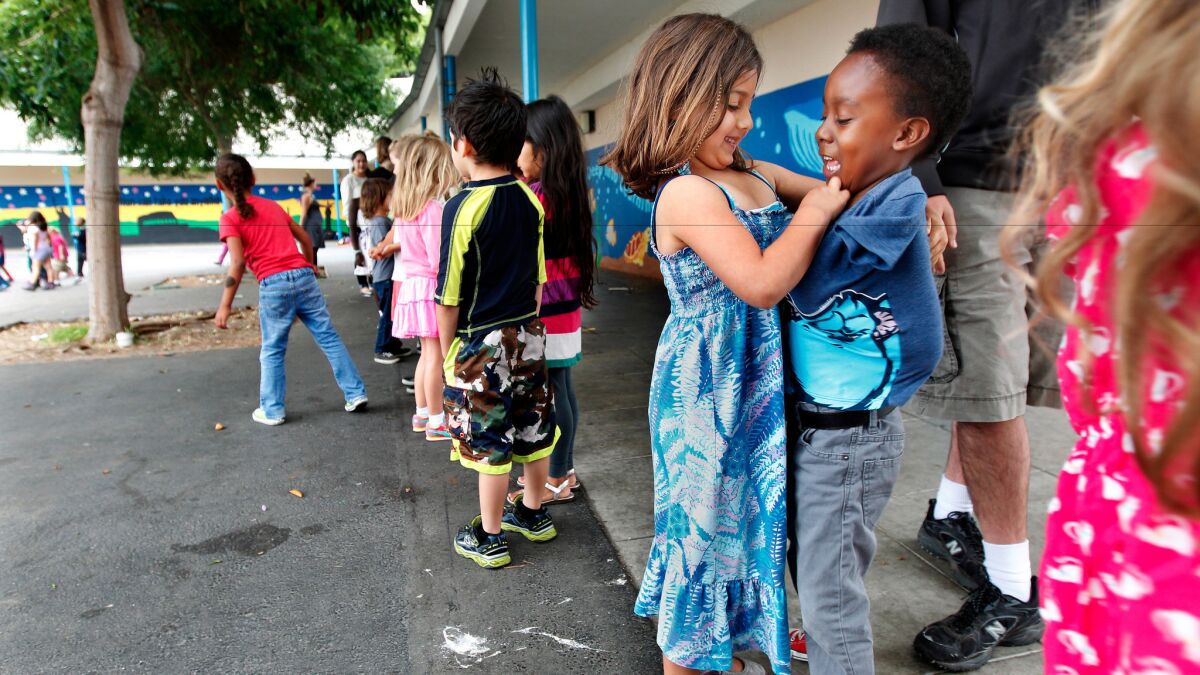 Kindergarten students Sasha Framularo and Langston Vincent, right, play at Citizens of the World Charter School in Mar Vista in 2014. At the time, the charter school was located on the campus of Stoner Avenue Elementary, an LAUSD school.