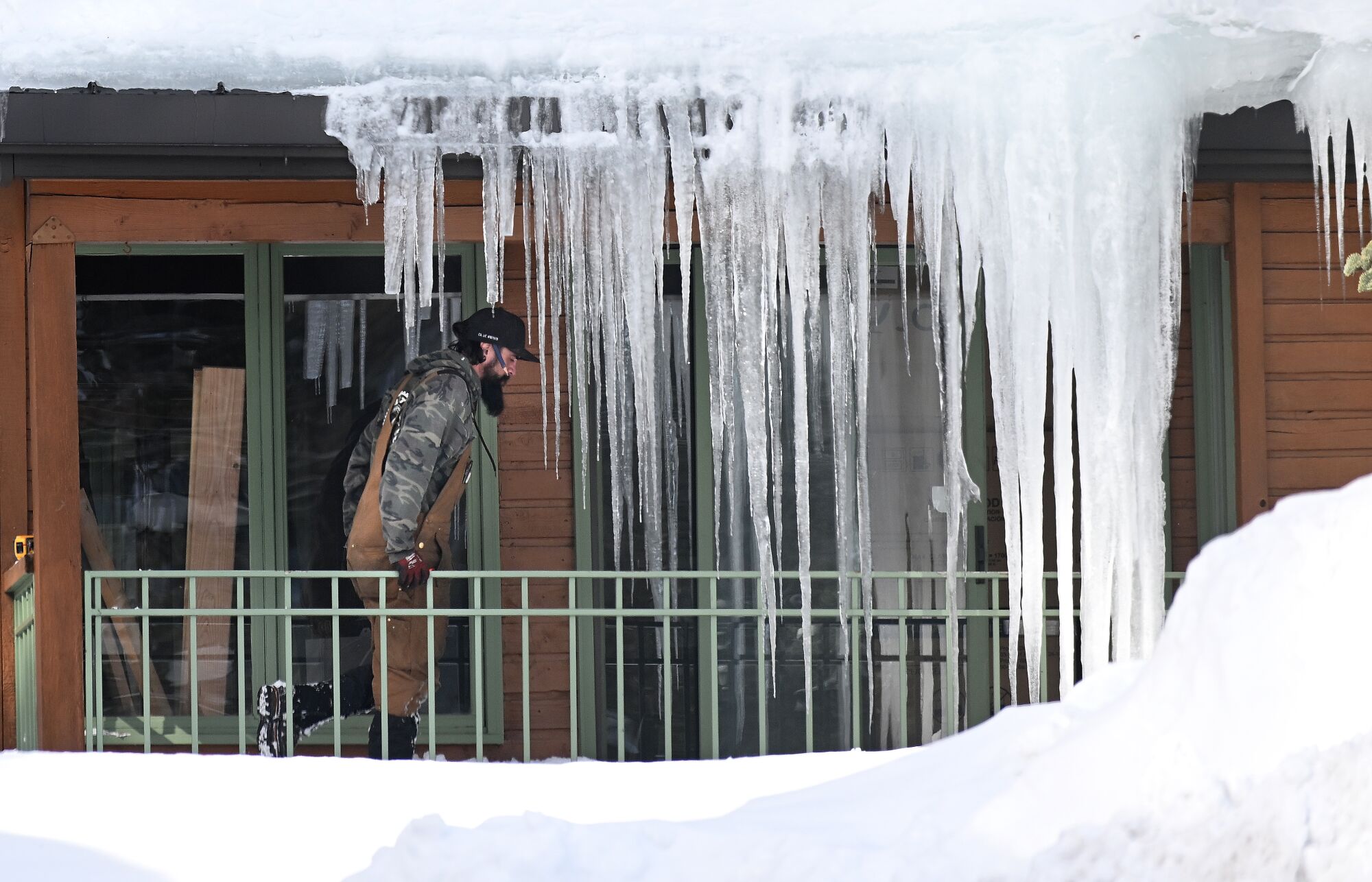 Icicles frame a porch being inspected on Davison Road in Mammoth Lakes.