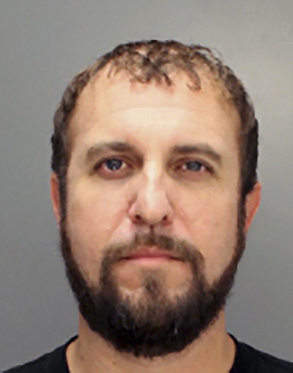 FILE - This image provided by the Philadelphia Police Department shows Joshua Macias. Macias and Antonio LaMotta, two supporters of former President Donald Trump arrested after driving a Hummer with guns and ammunition to a Philadelphia site where votes were being counted in November 2020, were convicted of weapons charges Wednesday, Oct. 12, 2022, but acquitted of election interference. (Philadelphia Police Department via AP, File)