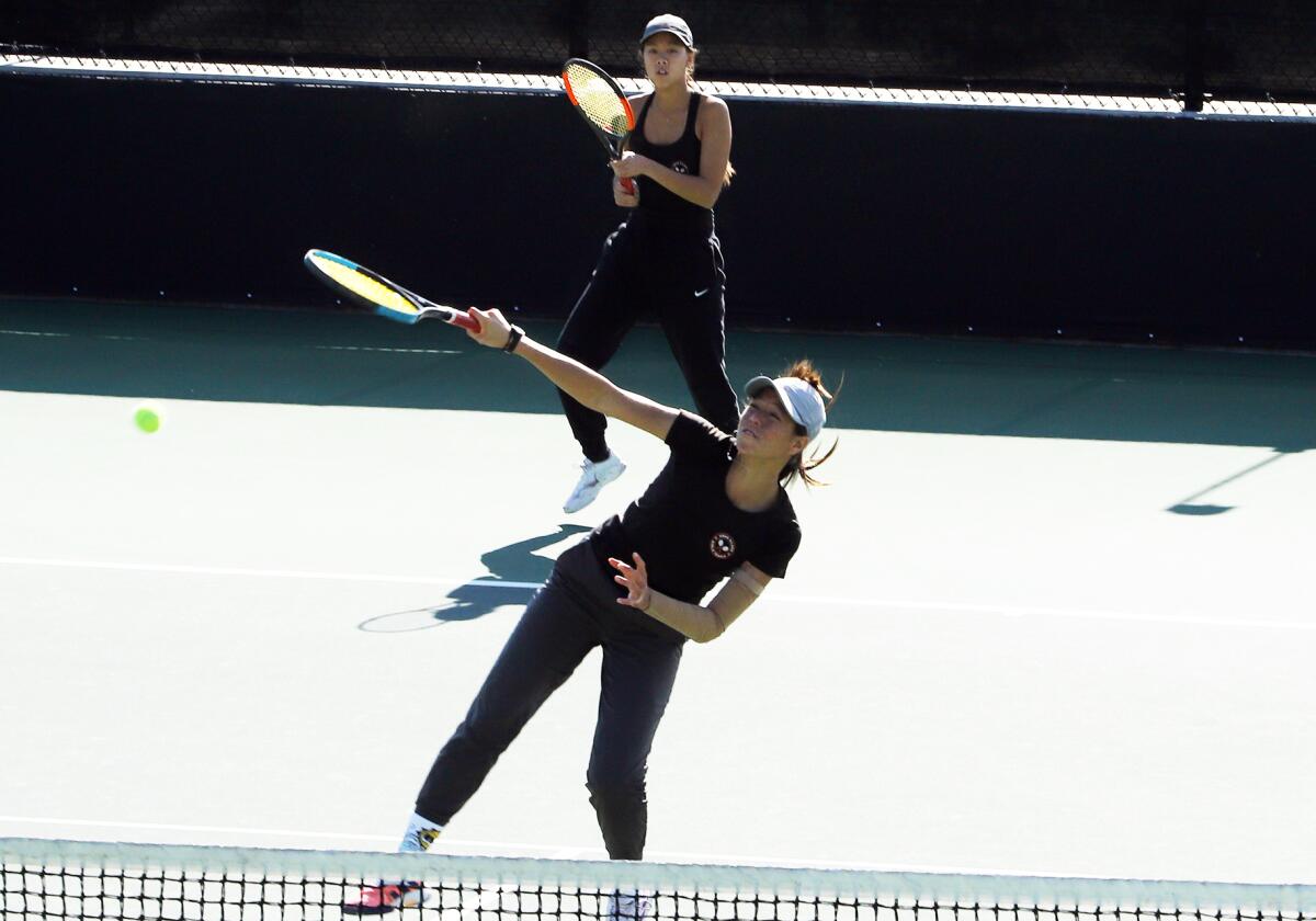 Tennis sisters Le Nhi and Yen Nhi Huynh-Nguyen compete at the CIF Southern Section Individuals Tournament.