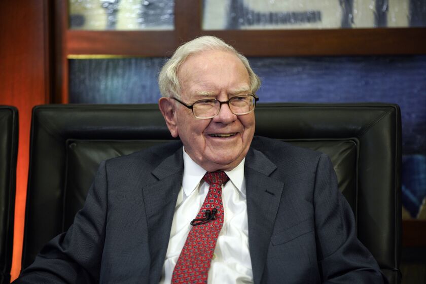 FILE - Berkshire Hathaway Chairman and CEO Warren Buffett smiles during an interview in Omaha, Neb., May 7, 2018. Buffett's company, Berkshire Hathaway Inc., bought more than $200 million more Occidental Petroleum stock over the past week to give it control of 23.6% of the oil producer's stock. Berkshire Hathaway disclosed its latest purchases of 3.67 million shares in a filing with the Securities and Exchange Commission on Monday evening, March 27, 2023. (AP Photo/Nati Harnik, File)