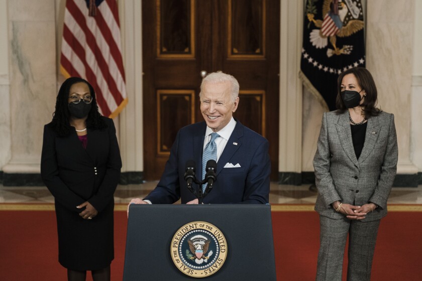 President Biden stands between Judge Ketanji Brown Jackson and Vice President Kamala Harris at the White House