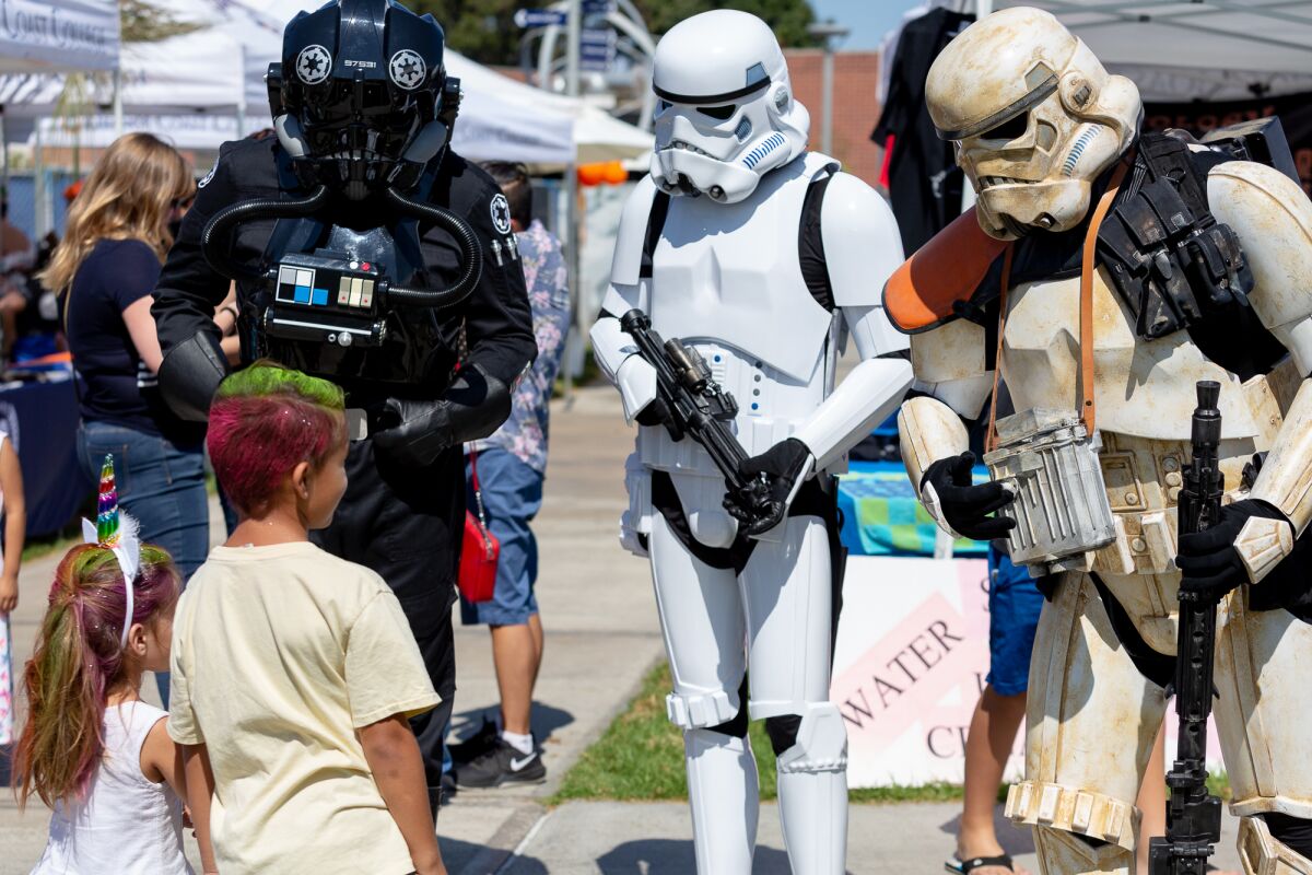 Star Wars stormtroopers confront attendees at the Orange County Children's Book Festival, which returns to OCC Sunday.