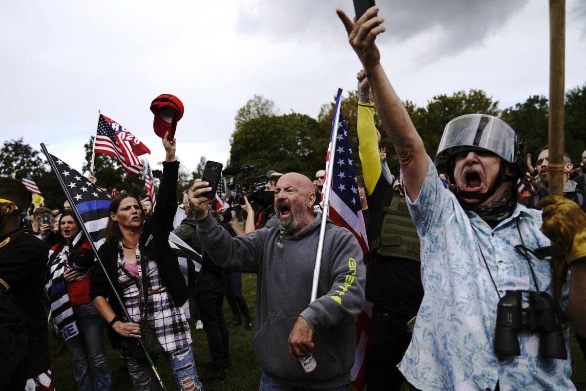 Members of the Proud Boys and other right-wing demonstrators rally on Saturday in Portland.