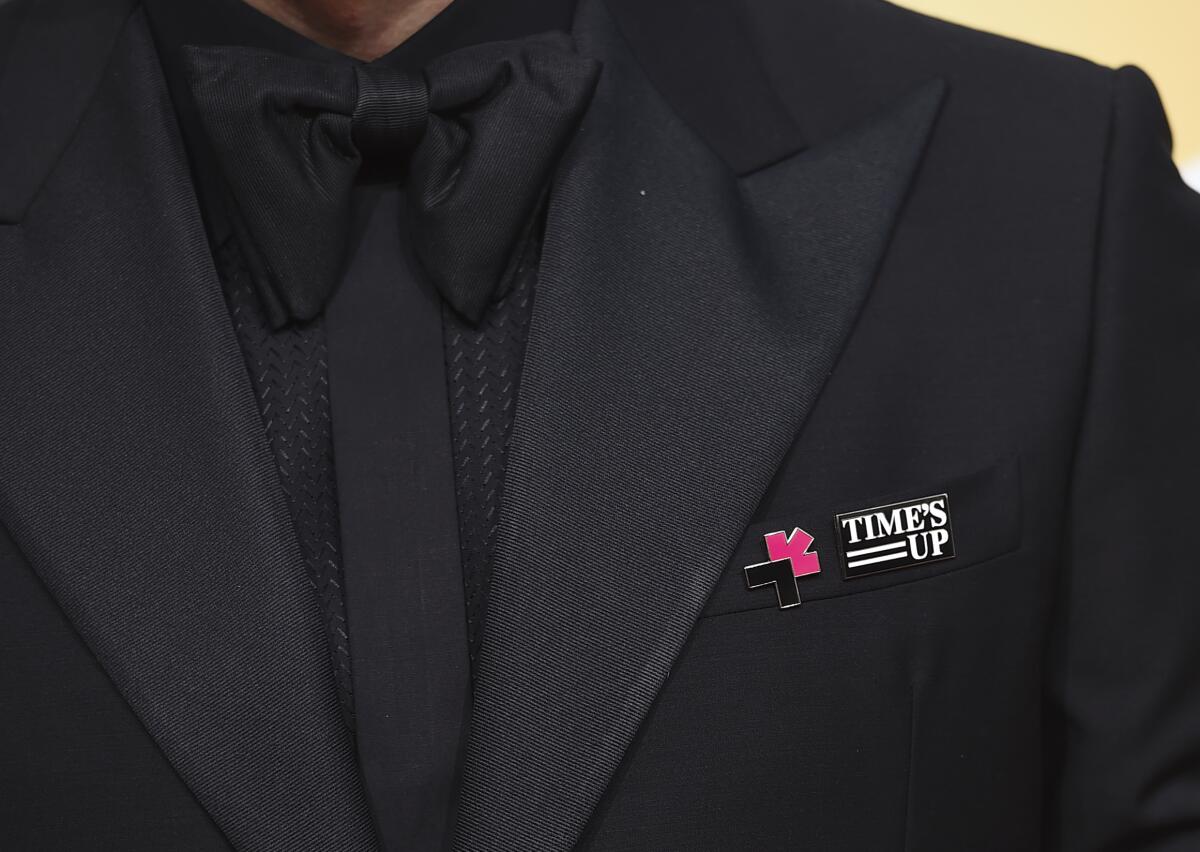 Edgar Ramírez wears a Time's Up pin on his lapel. 