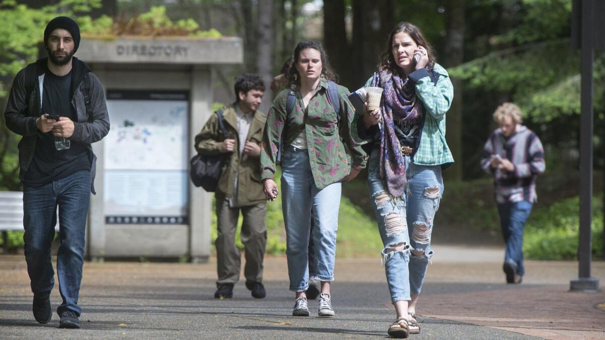 Students leave the Evergreen State College campus in Olympia, Wash. on June 1, 2017 after a threat prompted an evacuation, following weeks of protests on the progressive campus.