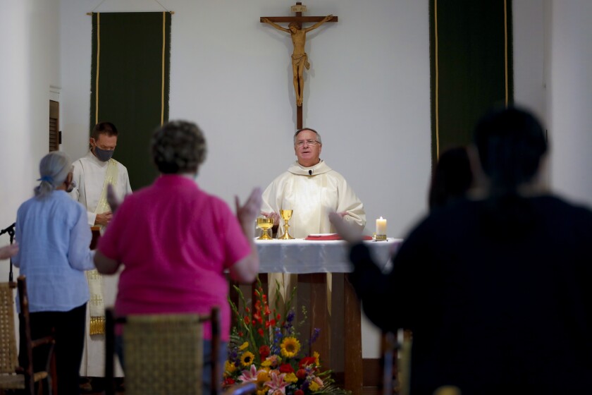 Bishop John Dolan offers mass at Father Joe's Villages in San Diego