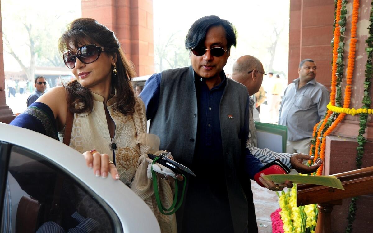 Sashis Tharoor and his wife, Sunanda Pushkar Tharoor, are shown arriving at Parliament in New Delhi.