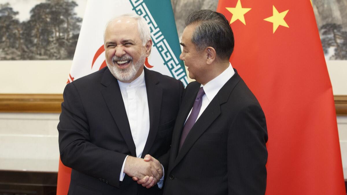 Iranian Foreign Minister Mohammad Javad Zarif meets Chinese Foreign Minister Wang Yi in Beijing on Friday. China was one of the signatories on Iran’s 2015 nuclear deal with world powers.