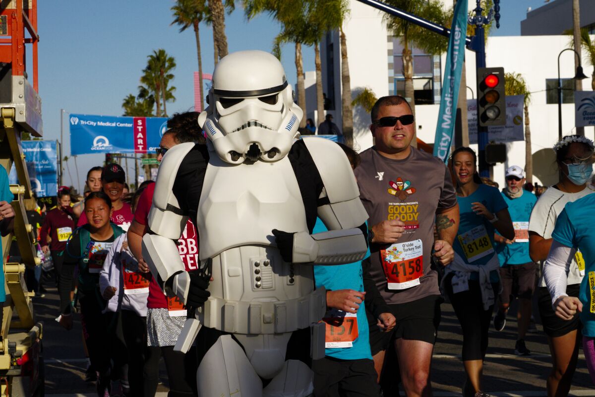 A Stormtrooper and thousands of other runners take on the 16th Annual Oceanside Turkey Trot on Thursday.