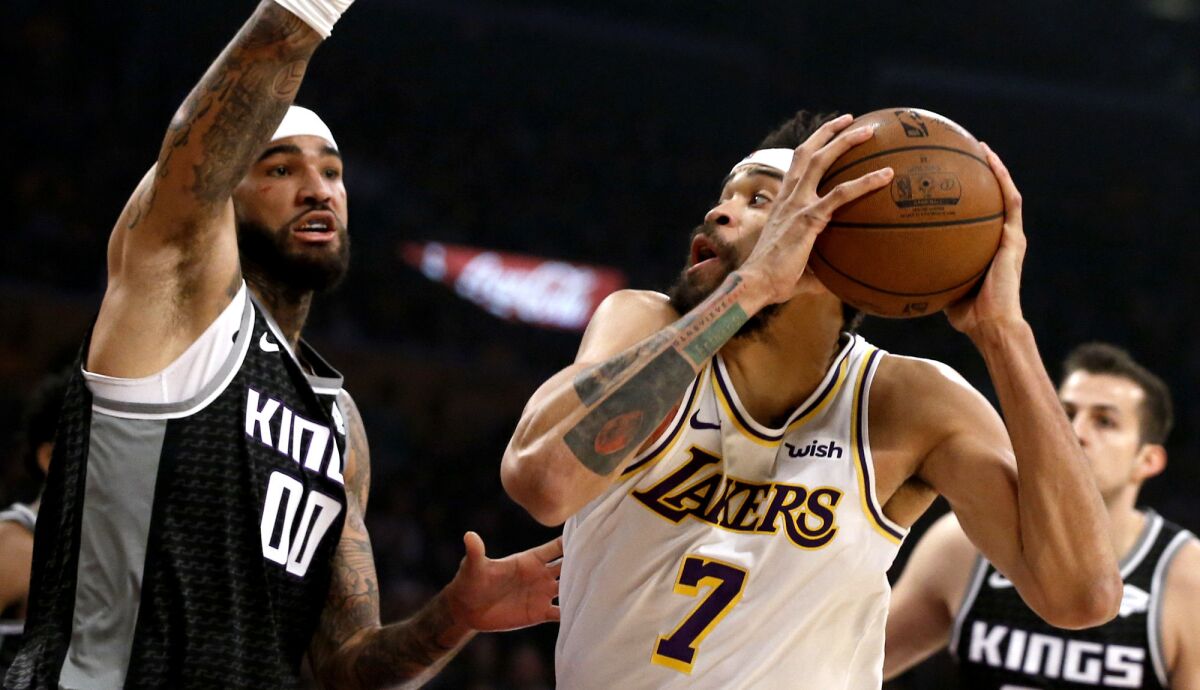 Lakers center JaVale McGee looks to shoot againstKings center Willie Cauley-Stein during the first half Sunday.