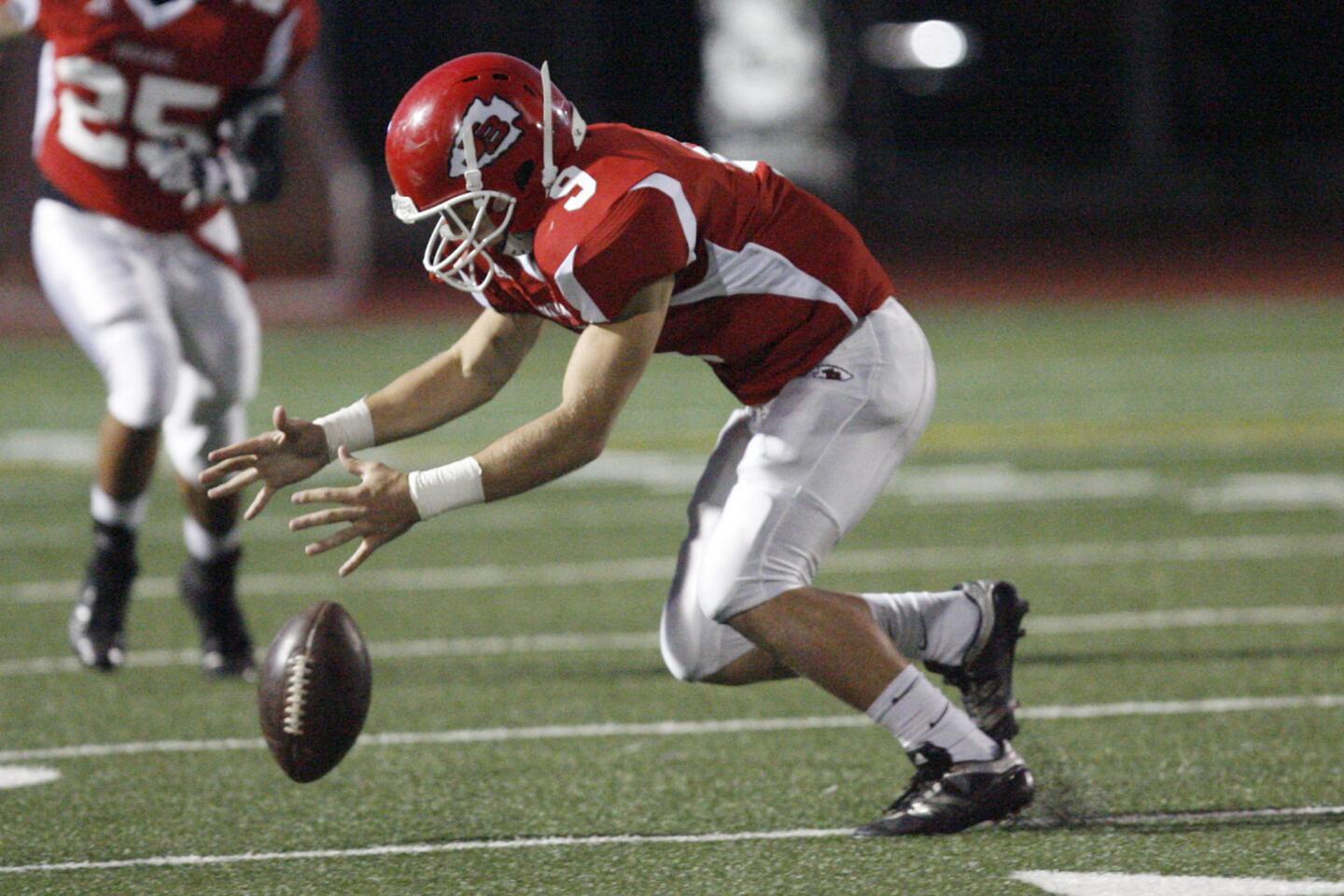 Burroughs' Garrett Manoukian misses the ball at kickoff during a game against Glendale at John Burroughs High School in Burbank on Thursday, September 27, 2012.