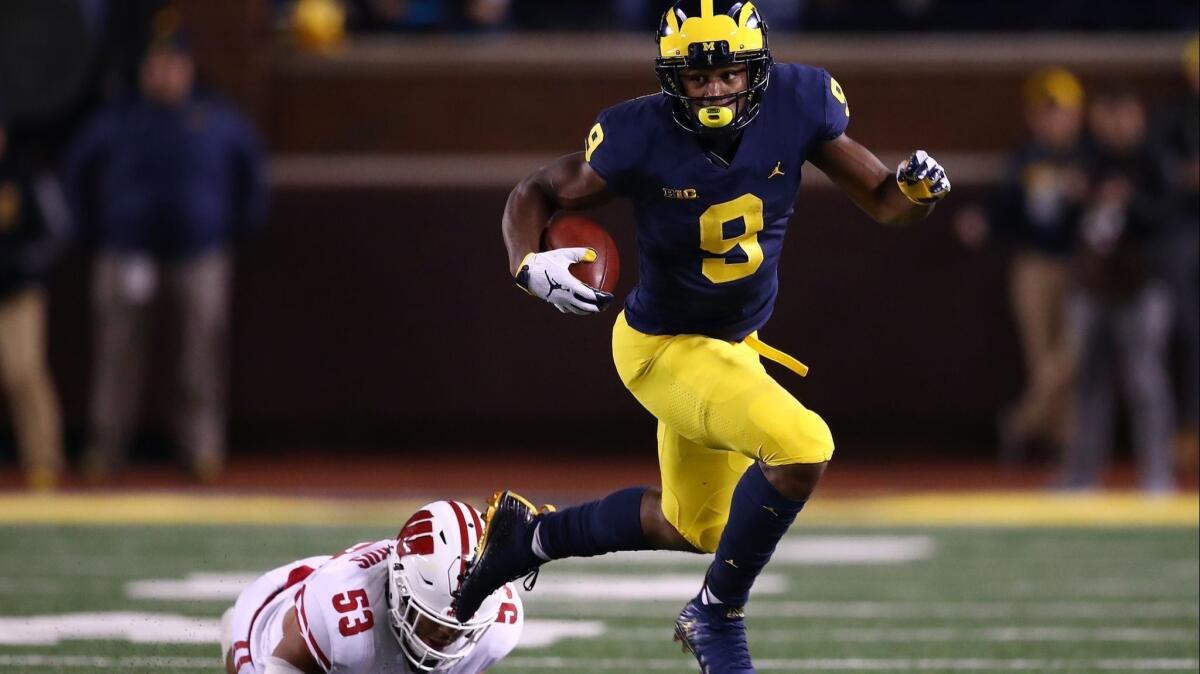 Michigan's Donovan Peoples-Jones escapes the tackle of Wisconsin's T.J. Edwards during a first half punt return on Oct. 13 at Michigan Stadium in Ann Arbor, Mich.