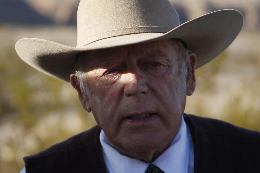 Rancher Cliven Bundy speaks to reporters on Jan. 27 in Bunkerville, Nev. He was arrested this week at the Portland, Ore., airport, apparently on his way to show support for his incarcerated sons and others who led the armed occupation of the wildlife refuge.