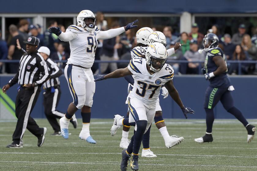 Safety Jaleel Addae and the Chargers defense clebrate after stopping a Seattle Seahawks drive on the fourth quarter Sunday at Century Link Field in Seattle.