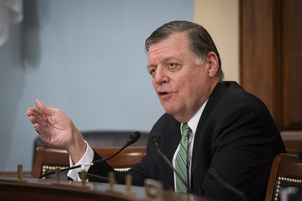 FILE - In this June 4, 2020, file photo, Rep. Tom Cole, R-Okla., speaks during a hearing on Capitol Hill in Washington. A dirty word for many Republicans is making the rounds on Capitol Hill -- earmarks. For nearly a decade, both chambers of Congress have abided by a ban on earmarks, or spending requested by a lawmaker to fund a specific project or institution back home. But Democrats are moving to bring back the practice, leaving the GOP lawmakers divided over how to respond.(Al Drago/Pool via AP, File)