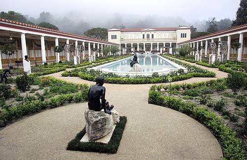 The Roman-inspired Getty folly in Pacific Palisades includes an inner courtyard with reflecting pool, statuary, covered walkways and hedged paths. The villa and its grounds, which have been undergoing renovation since 1997, will reopen to the public later this month.