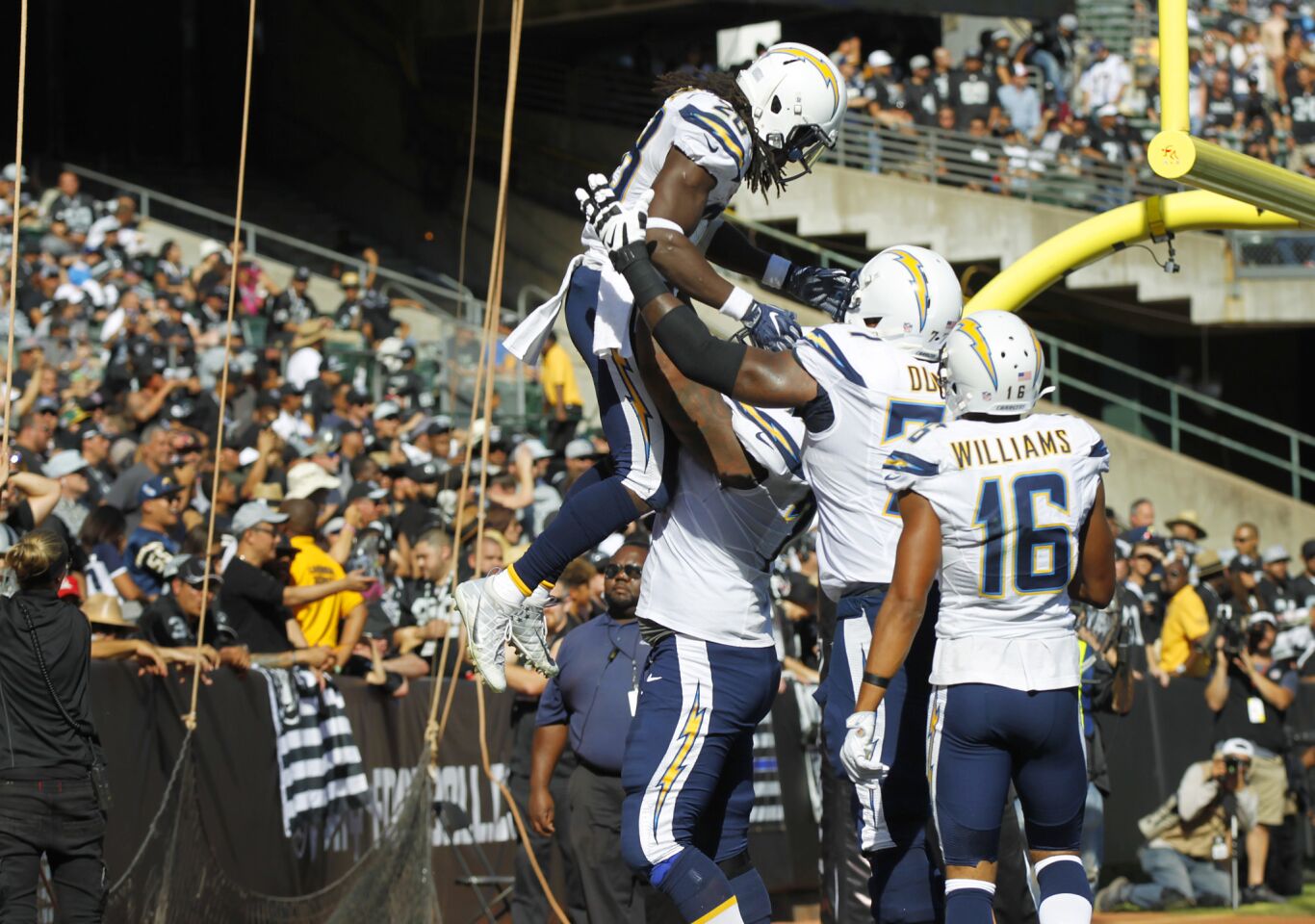 San Diego Chargers Melvin Gordon celebrates a touchdown against the Raiders in the 3rd quarter in Oakland on Oct. 9, 2016. (Photo by K.C. Alfred/The San Diego Union-Tribune)