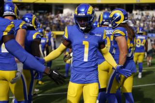Los Angeles Rams cornerback Derion Kendrick (1) greets teammates as he is introduced.