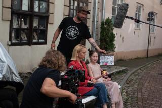 On set of the Lithuanian series Troliu? Ferma (Troll Farm), directed by Ernestas Jankauskas. The producer Gabija Siurbyte? is also a main actress in the series. Next to her sit a young actress Vilte? S?iaulyte?. Vilnius, Lithuania.